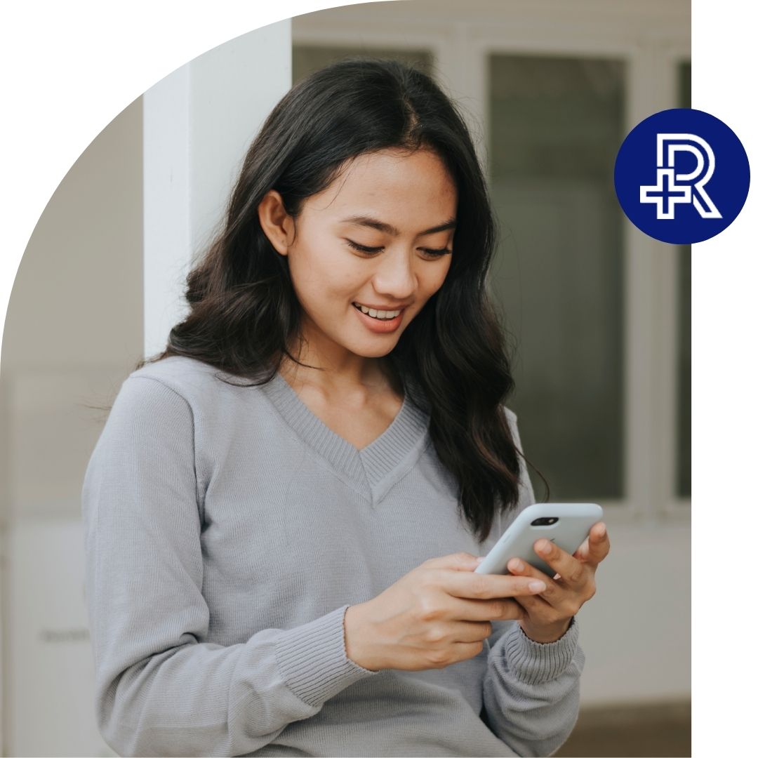 a woman smiling on her phone