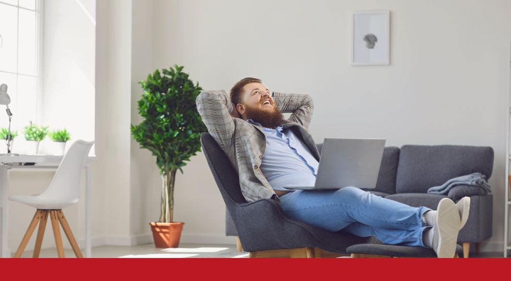 a man relaxing with a laptop