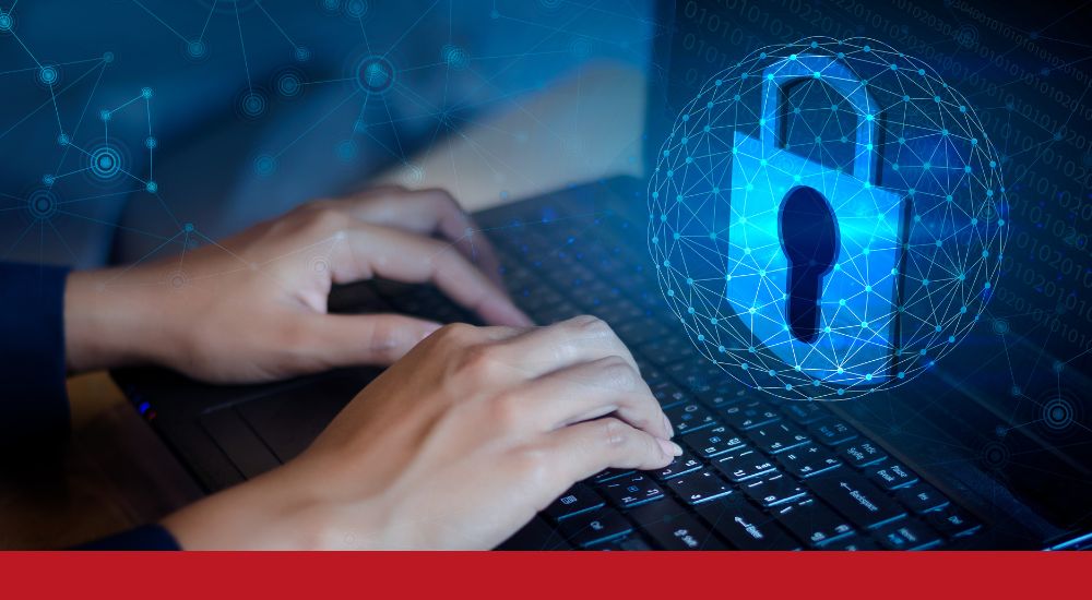 a person typing on a computer with a lock